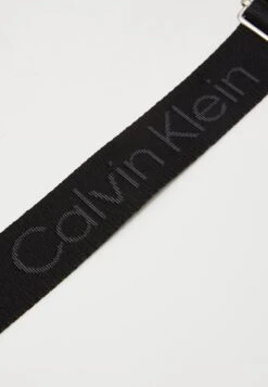 Calvin Klein WEBBING STRAP CAMERA BAG - Cross Body Bag - Black -Stock X 068d5047c5d64521aa6ff52c0850e341