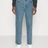 Filippa K Baggy Tapered Jeans - Jeans Tapered Fit - Allover Stone