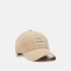 Calvin Klein Jeans Neutral Mono Unisex - Cap - Travertine -Stock X 0f90c2abb07e41f48cd9807ccea8a308
