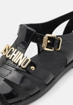 MOSCHINO Sandals - Nero -Stock X 10b0a89dd096459091c2a60b9d888d33