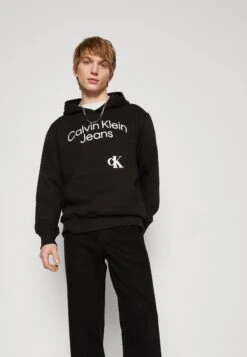 Calvin Klein Jeans Curved Stacked Logo Hoodie - Hoodie - Black -Stock X 17d0a162ffaa4b32b396f4bc0fb0542b