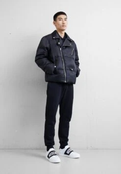 MOSCHINO Slip-Ons - Black/White -Stock X 2170e12f1af7438596bc0de52d45e11a