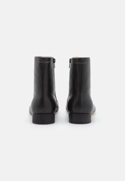MM6 Maison Margiela Ankle Boot - Classic Ankle Boots - Black -Stock X 29080899c9704ed4bef7c0aa72bbdbf3