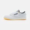 Reebok Classic Jurassic World Club Revenge Unisex - Trainers - Spirit White/Silver Metallic/Track Gold -Stock X 404d841ecd7845b7bf9bdb78f520127f