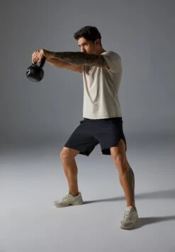 QUICK DRY SHORT SLEEVE T-SHIRT WITH REFLECTIVE STRIP - Sports T-shirt - Beige -Stock X 46a38e46cf74443bbde30a568f3fb22b