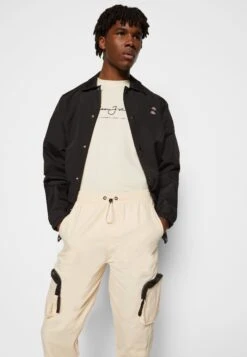 Sean John Script Logo Trackpants - Cargo Trousers - Beige -Stock X 497373f6030240ddbc7e499ca0266827