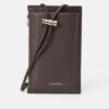 Calvin Klein EMBOSS PHONE CROSSBODY - Phone Pouch - Dark Brown