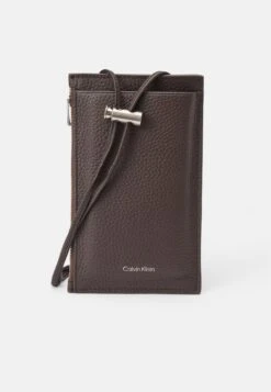 Calvin Klein EMBOSS PHONE CROSSBODY - Phone Pouch - Dark Brown