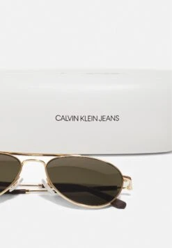 Calvin Klein Jeans Unisex - Sunglasses - Shiny Gold-Coloured -Stock X 661f602e8a854a0ab701b625fe399bfd
