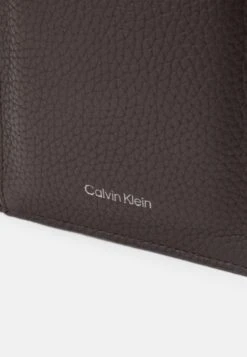 Calvin Klein EMBOSS PHONE CROSSBODY - Phone Pouch - Dark Brown -Stock X 7ef61e9501de4a91881d5dd4d6d353c8