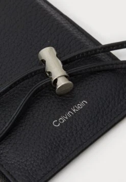 Calvin Klein EMBOSS PHONE CROSSBODY - Phone Pouch - Black 10 Calvin Klein EMBOSS PHONE CROSSBODY - Phone Pouch - Black -Stock X 8aefd5d2515f4e9d8367e09bda6a7202