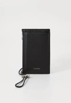 Calvin Klein EMBOSS PHONE CROSSBODY - Phone Pouch - Dark Brown -Stock X 8d7f313aef5748a2b8a42ff8a649180c