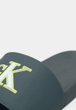 Calvin Klein Jeans SLIDE MONO - Mules - Seaside Aqua/white -Stock X 8dad959777bc450294054fe7332b4dfd