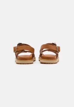 MCM Collection Slide - Sandals - Cognac -Stock X 8e43d3e2914c4951a7d59fdd083bd624