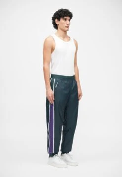 EA7 Emporio Armani TRAIN GRAPHIC SERIES PANTS MONOGRAM - Tracksuit Bottoms - Dark Green Fancy -Stock X 93acc1e742e14d3b97c754e656522f07