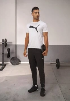 Puma ESSENTIALS TAPERED PANT - Tracksuit Bottoms - Black -Stock X 9a8af4d268a54a2eaa70d06d405de9e3