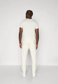 BJØRN BORG ESSENTIAL - Tracksuit Bottoms - Tofu 11 BJØRN BORG ESSENTIAL - Tracksuit Bottoms - Tofu -Stock X a04f8320188a4d2dbe64d148709f0d9c