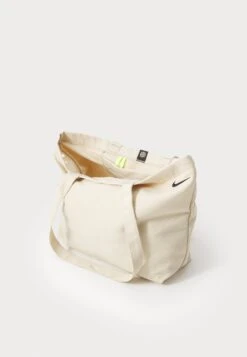 Nike Sportswear HERITAGE TOTE UNISEX - Tote Bag - Oatmeal/volt/black -Stock X a10860f02b2e40d89712532731bc008d