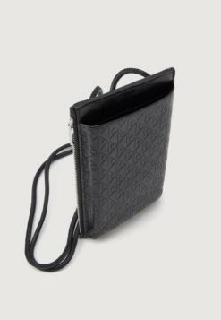 Calvin Klein EMBOSSED EMBLEM PHONE CROSSBODY - Phone Pouch - Black -Stock X a7ab870e6c9b4c749975a36faefc0790