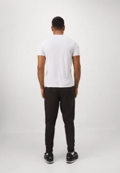 Puma ESSENTIALS TAPERED PANT - Tracksuit Bottoms - Black -Stock X a97112edd8bd4d169410b1c64e1759c1