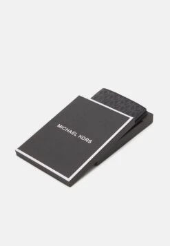 Michael Kors Passport Wallet - Passport Holder - Black 10 Michael Kors Passport Wallet - Passport Holder - Black -Stock X aa23518b69fb463cb83a1690036383df