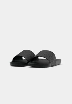 Calvin Klein POOL SLIDE MONO - Mules - Triple Black -Stock X b17d98ac0a0d42a5a8aa191d0dc995e7