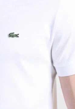 Lacoste Unisex - Polo Shirt - White -Stock X b9e72d46452a4b31a9f6ddf1fcec8b46