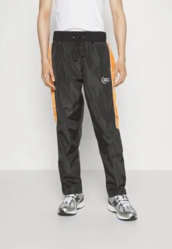 NIGHT ADDICT Namoon Unisex - Tracksuit Bottoms - Black/Orange