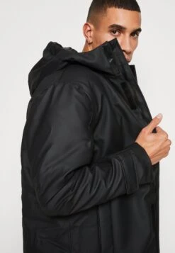 Rains Glacial Coat Unisex - Winter Coat - Schwarz -Stock X c49860db89ec4f5bb51451e7d81cfa10