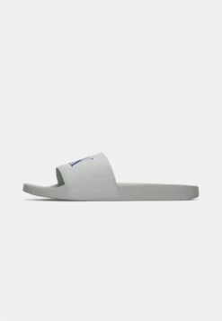 Calvin Klein Jeans SLIDE MONO - Mules - Seaside Aqua/white -Stock X dfa55d539d964e3eacb37b53a65c93b8