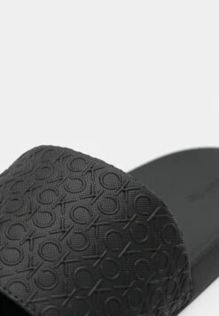 Calvin Klein POOL SLIDE MONO - Mules - Triple Black -Stock X e064a804f54142ae81655f9393e258e2