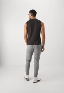 Puma TEAMGOAL SLEEVELESS - Top - Black/white/flat Dark Gray -Stock X ed14cd6ddfed4fc7bc4578047ab408a1