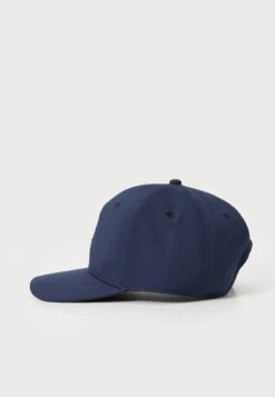 PUMA Golf HERITAGE P TECH CAP - Cap - Deep Navy -Stock X ed4de993cccf4a768eb5067f215ccf0c