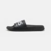 Havaianas Slide Classic Logomania Unisex - Pool Slides - Black -Stock X f38ed9e0ab9a45e1b97e7e94abf5627b