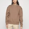 Calvin Klein Jeans Logo Mock Neck - Sweatshirt - Warm Toffee -Stock X f9281d1c51a54067be2125c763bd6333