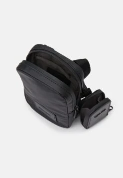 Calvin Klein PUFFER UTILITY PHONE CROSSBODY - Phone Pouch - Black 9 Calvin Klein PUFFER UTILITY PHONE CROSSBODY - Phone Pouch - Black -Stock X fbd422a8eac44818a198ec91c080e995