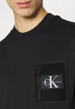 Calvin Klein Jeans Pocket Tee Unisex - Basic T-Shirt - Black -Stock X fd27d635e0334a37a10b4587c4bf4f1b